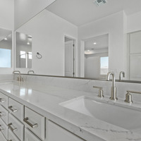 Medium dual owner vanities and granite tops