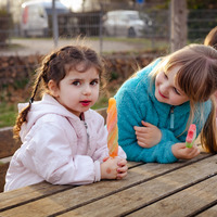 Medium children eat ice cream in the playground outdoor 2023 11 27 05 05 09 utc