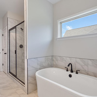 Medium master bathroom bathtub