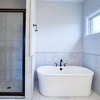 Medium master bathroom tub and shower