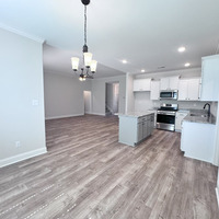 Medium eating area looking into kitchen