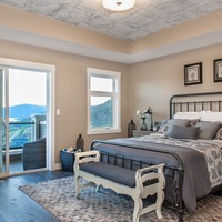 Medium master bedroom with a view