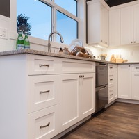 Medium white kitchen cabinets stainless steel appliances