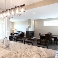 Medium 19 emerald hill dr. show home for sale by emerald park homes white city walk out bungalow large kitchen island black light fixture 1024x685