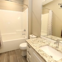 Medium 19 emerald hill dr. show home for sale by emerald park homes white city walk out bungalow main floor four piece bathroom tub shower granite tops 1024x683